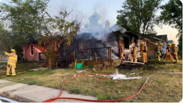 Firefighters on the scene of a Regina duplex fire over the weekend. (Regina Fire Department - image credit)