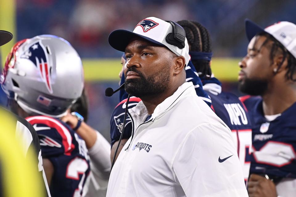 August 8, 2024; Foxborough, MA, USA; New England Patriots head coach Jerod Mayo watches the video boards after challenging a call on the field during the second half against the Carolina Panthers at Gillette Stadium. Mandatory Credit: Eric Canha-USA TODAY Sports