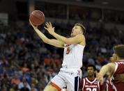 Virginia's Kyle Guy (5) drives for a layup during the second half of a second round men's college basketball game against Oklahoma in the NCAA Tournament in Columbia, S.C. Sunday, March 24, 2019. (AP Photo/Richard Shiro)