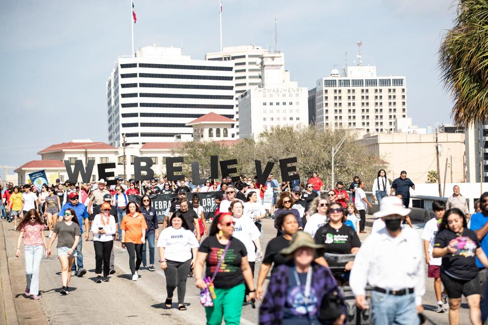 A Martin Luther King Jr. Day procession marches through Downtown Corpus Christi, on Monday, Jan. 16, 2023, in Texas.