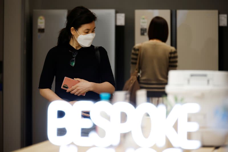 Women shop at a Samsung Electronics' store in Seoul