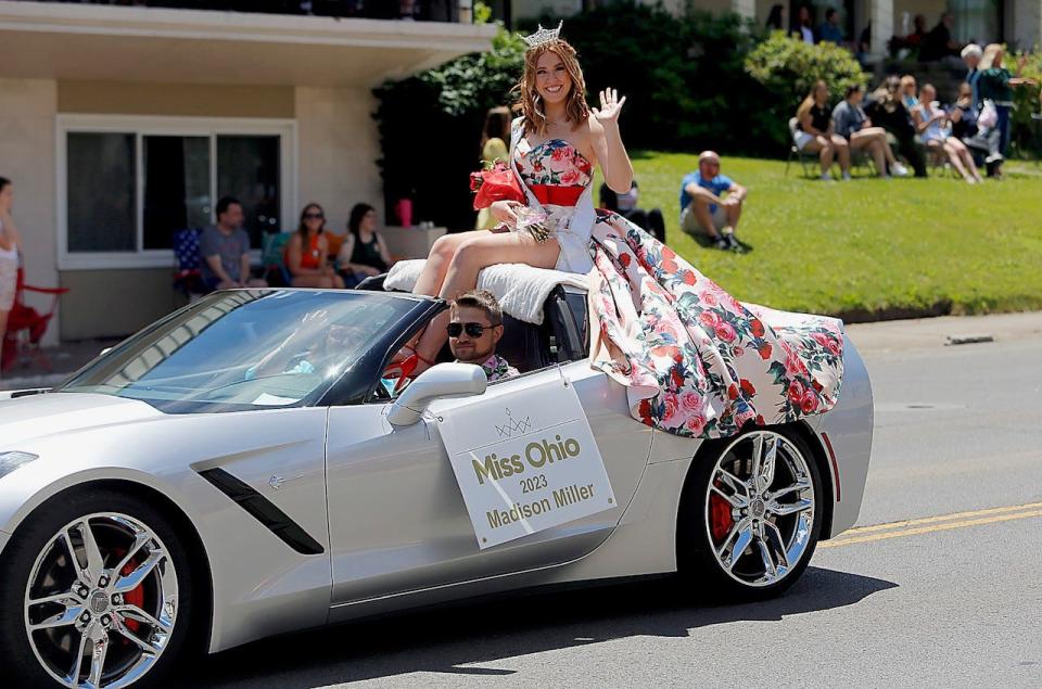 Miss Ohio Madison Miller waves to the crowd Sunday at the Miss Ohio Parade in downtown Mansfield.