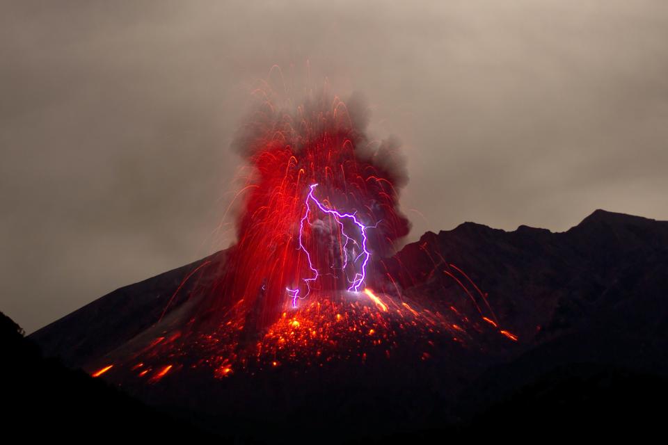 Sakurajima Volcano on the Japanese island of Kyushu showcases red and purple volcanic lightning in 2013. 