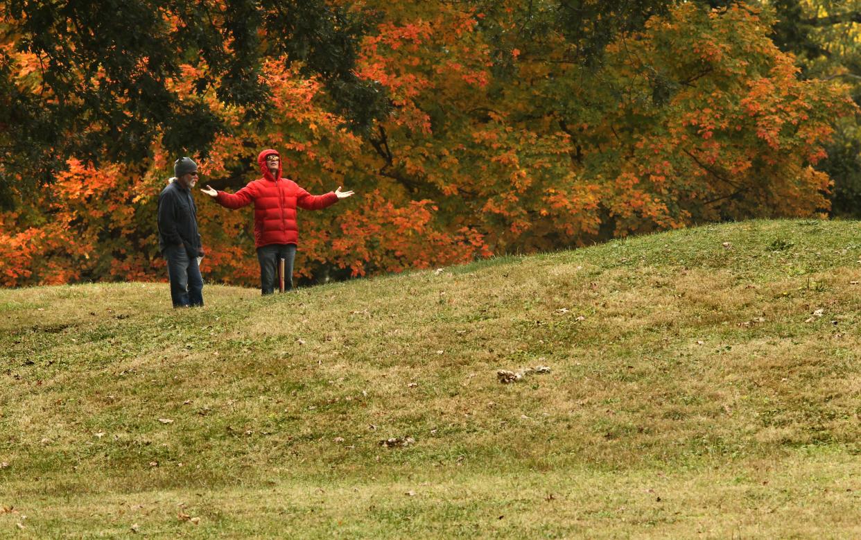 Gary Cox, left, and Kevin Eigel, both of Columbus, stand on Eagle Mound in the center of the Great Circle, on Sunday, October 15, 2023. The Ohio History Connection held events at the Great Circle and Octagon Earthworks to celebrate their designation as UNESCO World Heritage Sites.