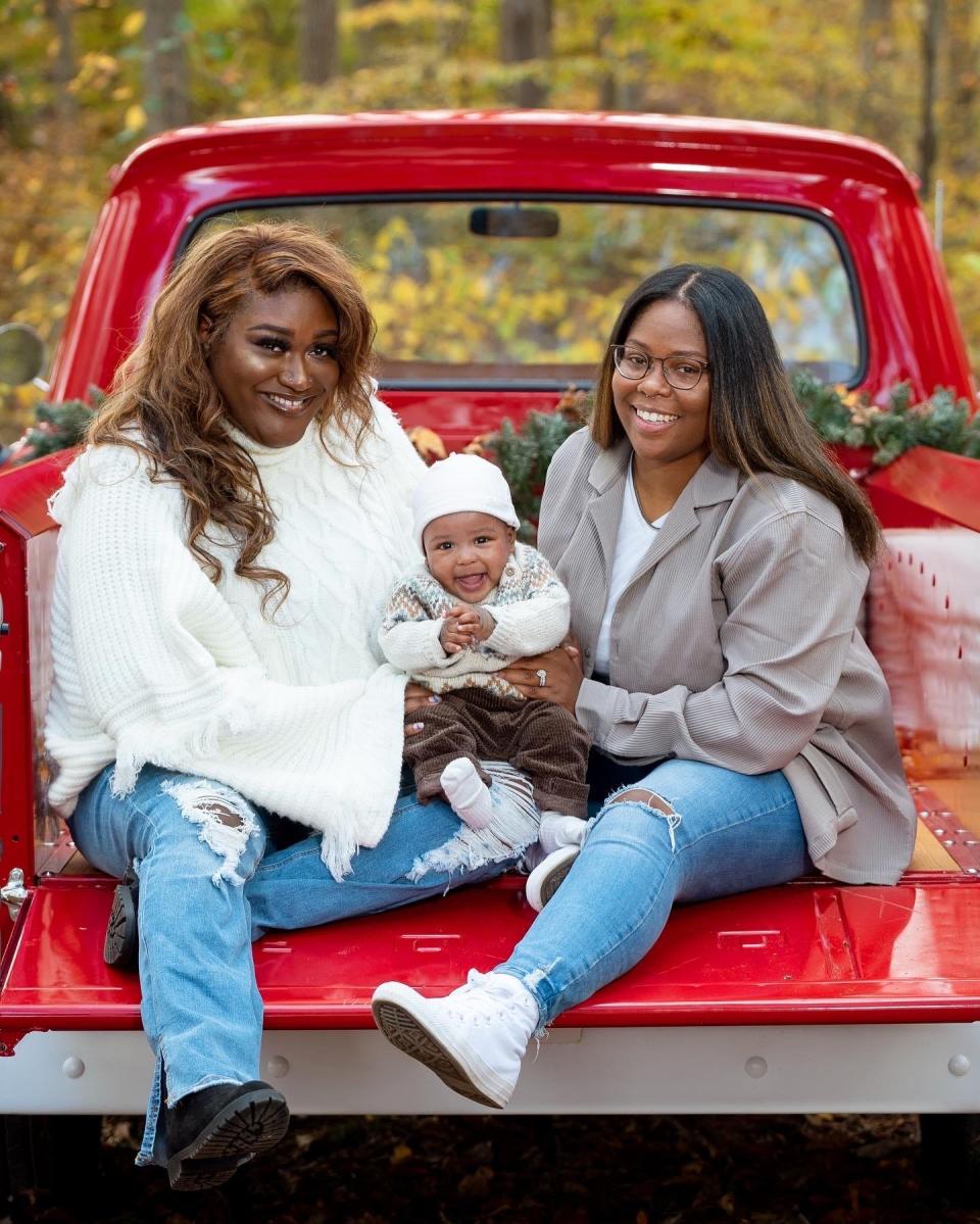 Mardochée and Yevette Julien-West hold their baby boy, who they had through in vitro fertilization after trying to find the perfect sperm donor for years.