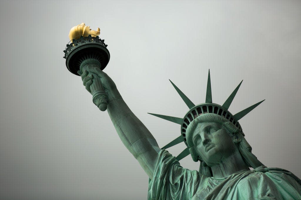 Standing on Liberty Island in New York Harbor, the Statue of Liberty welcomes visitors, immigrants and returning Americans.