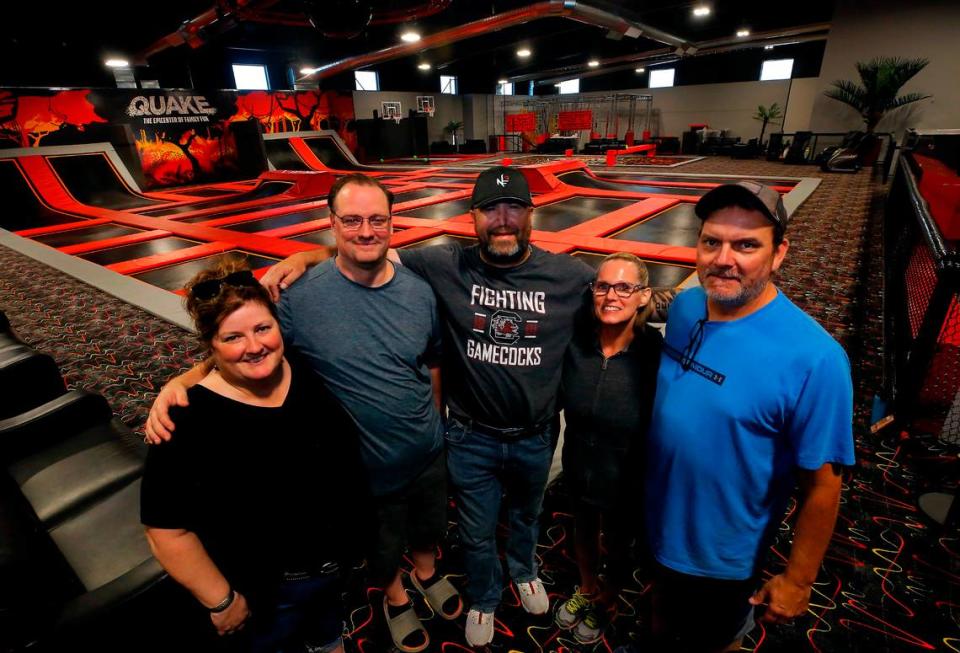 Business partners Merry Holmes, Paul Knabe, Mike Detrick and Tracy and Donavan Nickerson stand on the trampoline deck at the Quake Family Fun Center in Kennewick.