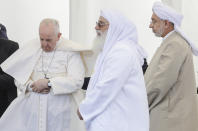 Pope Francis, left, attends an interreligious meeting near the archaeological area of the Sumerian city-state of Ur, 20 kilometers south-west of Nasiriyah, Iraq, Saturday, March 6, 2021. Ur is considered the traditional birthplace of Abraham, the prophet common to Muslims, Christians and Jews.Francis traveled to the southern ruins of Ur on Saturday to reinforce his message of interreligious tolerance and fraternity during the first-ever papal visit to Iraq, a country riven by religious and ethnic divisions. (AP Photo/Andrew Medichini)