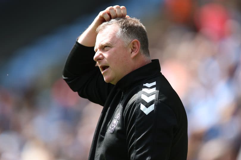 Coventry City manager Mark Robins on the touchline against QPR