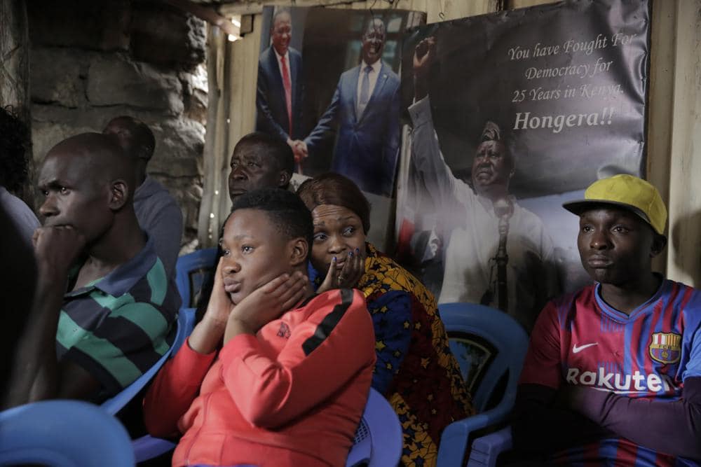 Supporters of Raila Odinga watch news on television after Kenya Supreme Court confirms Ruto Election and declare him as Kenyas 5th President, in Nairobi, Kenya, Monday Sept. 5, 2022. (AP Photo/Brian Inganga)