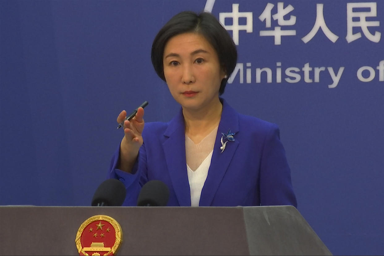 Chinese Foreign Ministry spokesperson Mao Ning gestures during a press conference.