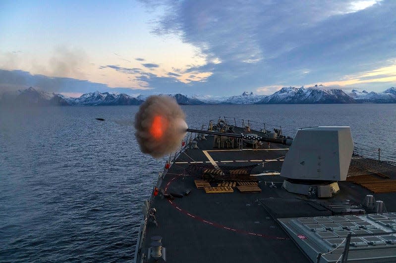 The guided-missile destroyer USS Gridley (DDG 101) fires its Mark 45 5-inch gun during a live-fire exercise.