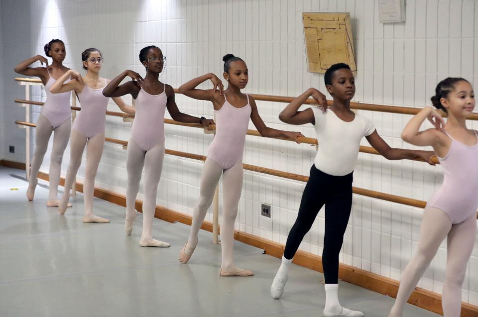 Laylah Guach, 11, center, a dance student at the Harlem School of the Arts, in ballet class in New York, Oct. 27, 2022. She has seen the Radio City Christmas Spectacular several times and has a deep appreciation for the world of precision dance.