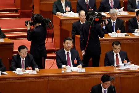 Chinese President Xi Jinping, Chinese Premier Li Keqiang and Zhang Dejiang, chairman of the Standing Committee of the National People's Congress (NPC), attend the opening session of the NPC at the Great Hall of the People in Beijing, China March 5, 2018. REUTERS/Jason Lee