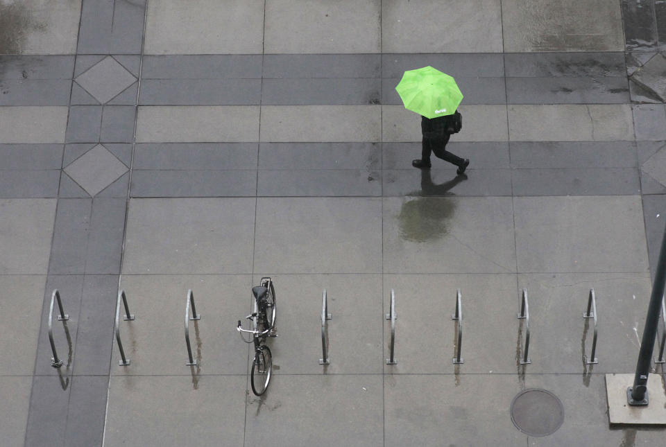 Umbrellas were called for as rain blanketed Sacramento, Calif, Monday, Oct. 22, 2012. The first storm of the season swept through Northern California bringing rain to the lower elevations and snow in the mountains. (AP Photo/Rich Pedroncelli)