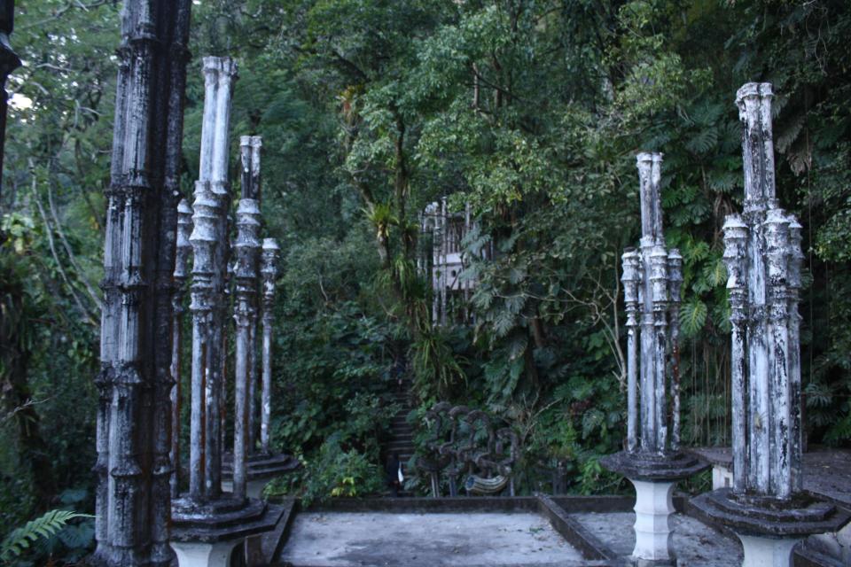 This Jan. 31, 2014 photo shows tall bamboo-shaped columns in Las Pozas, a dreamy, little-known garden of surreal art, where sculptures evoke the ruins of ancient Greece but are overrun by exotic plants in Mexico’s northeast jungle. Las Pozas is located on a 100-acre (40-hectare) hillside where the Sierra Madre mountains and coastal plains of the northeast state of San Luis Potosi meet. (AP Photo/Teresa de Miguel Escribano)