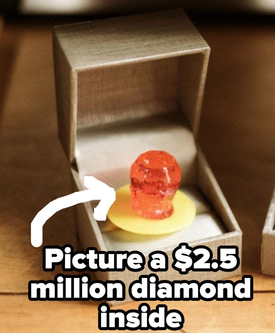 Candy ring in a wedding ring box with the caption "picture a $2.5million diamond inside