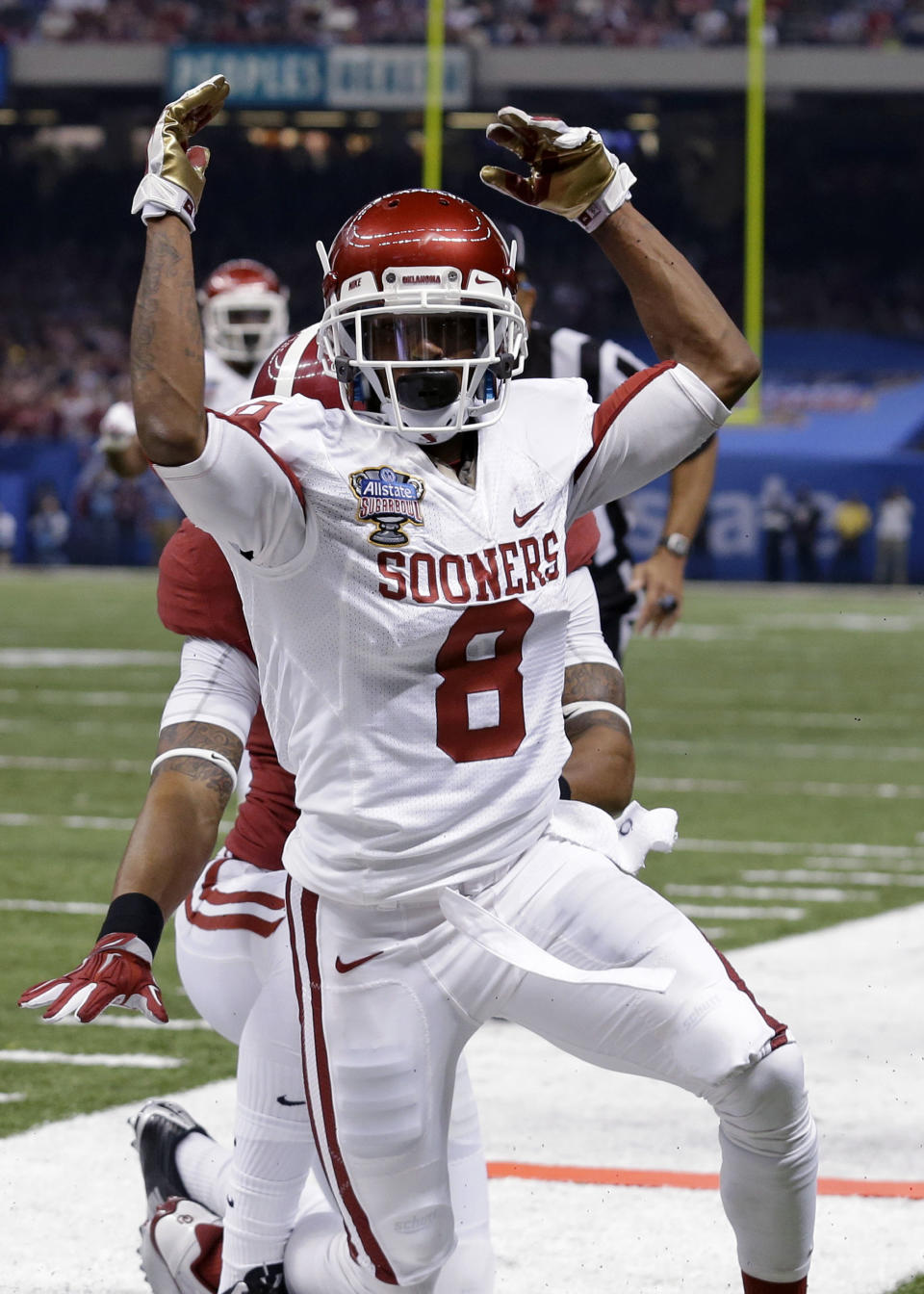 Oklahoma wide receiver Jalen Saunders (8) celebrates his touchdown reception during the first half of the Sugar Bowl NCAA college football game against Alabama, Thursday, Jan. 2, 2014, in New Orleans. (AP Photo/Rusty Costanza)