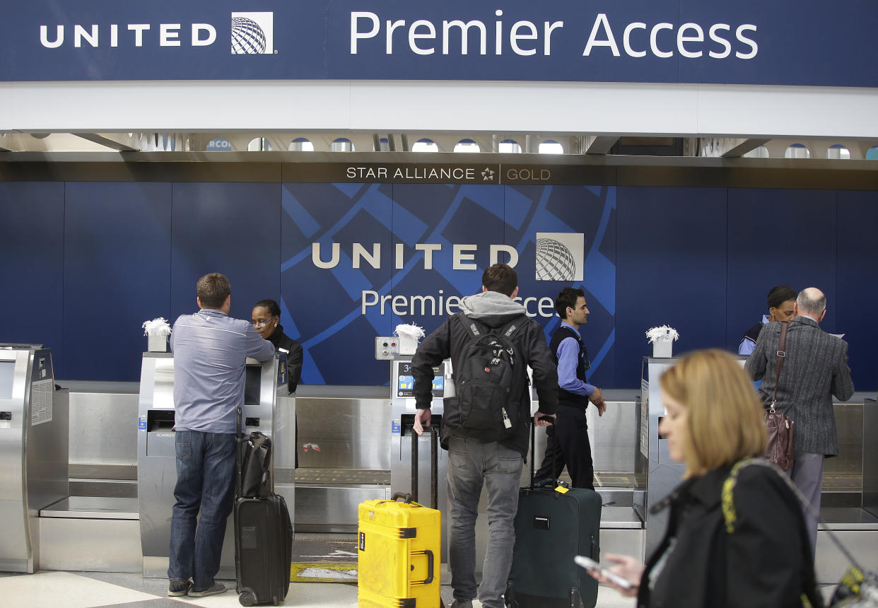 Travelers check in at a&nbsp;United Airlines counter at O'Hare International Airport in Chicago. The violent removal of a doctor from a United flight in Chicago in April was investigated by federal officials. (Photo: JOSHUA LOTT via Getty Images)