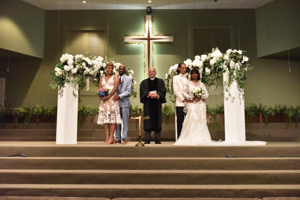 Couple Terrence John Teat and Kimberly Cawanna Shannon of Jackson, Miss. as well as Christopher Romal Walton and Darcia Machele Jackson of Vicksburg, Miss. get married as part of a mass wedding during Juneteenth celebrations at New Horizon Church in Jackson, Miss., Saturday, June 18, 2022.Juneteenth 205