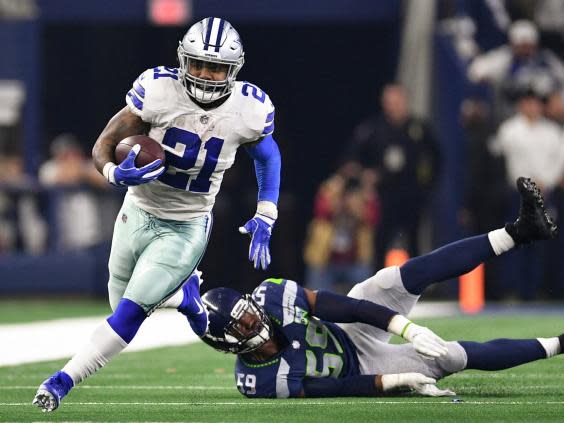 Ezekiel Elliott (21) runs past Seattle Seahawks linebacker Jake Martin (59) (Reuters)