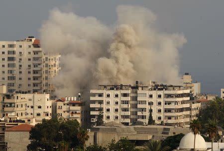 Smoke rises following what witnesses said was an Israeli air strike in Gaza City July 22, 2014. REUTERS/Ahmed Zakot