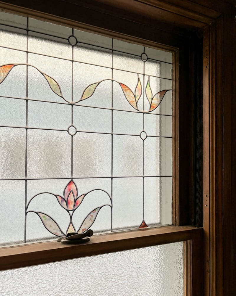 Stained glass window in bathroom.