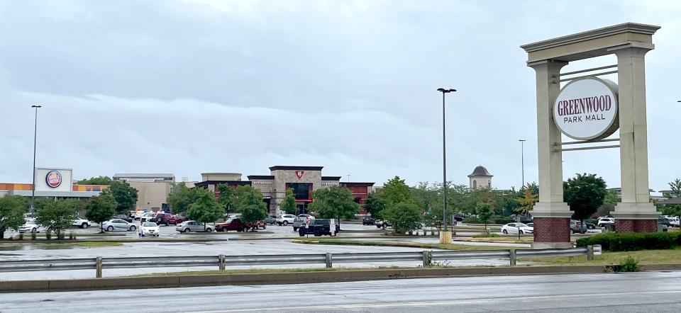 Emergency responders work a scene Sunday, July 17, 2022, at Greenwood Park Mall.