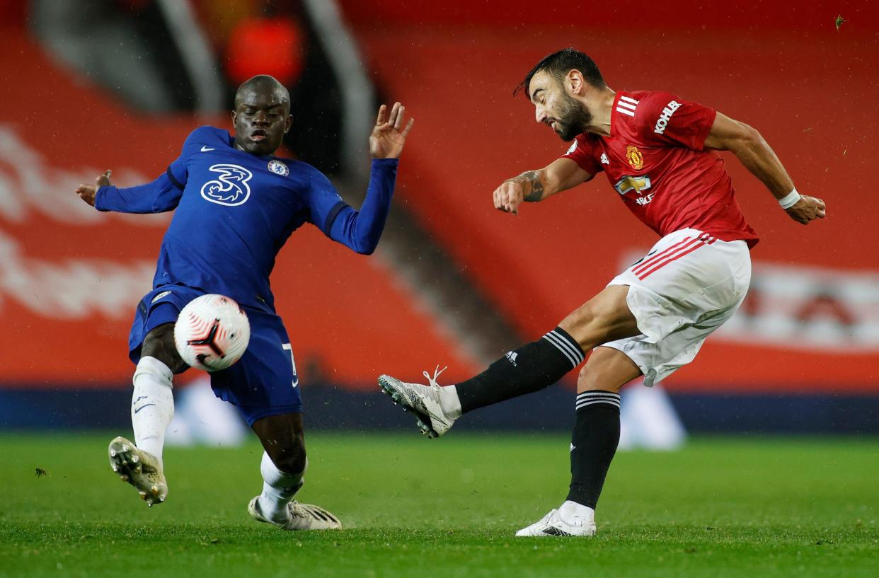 Manchester United's Bruno Fernandes (right) in action with Chelsea's N'Golo Kante.