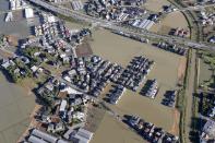 Houses are submerged in muddy waters as Typhoon Hagibis hit the area, in Kawagoe, north of Tokyo, Sunday, Oct. 13, 2019. Rescue efforts for people stranded in flooded areas are in full force after a powerful typhoon dashed heavy rainfall and winds through a widespread area of Japan, including Tokyo.(Takuya Inaba/Kyodo News via AP)