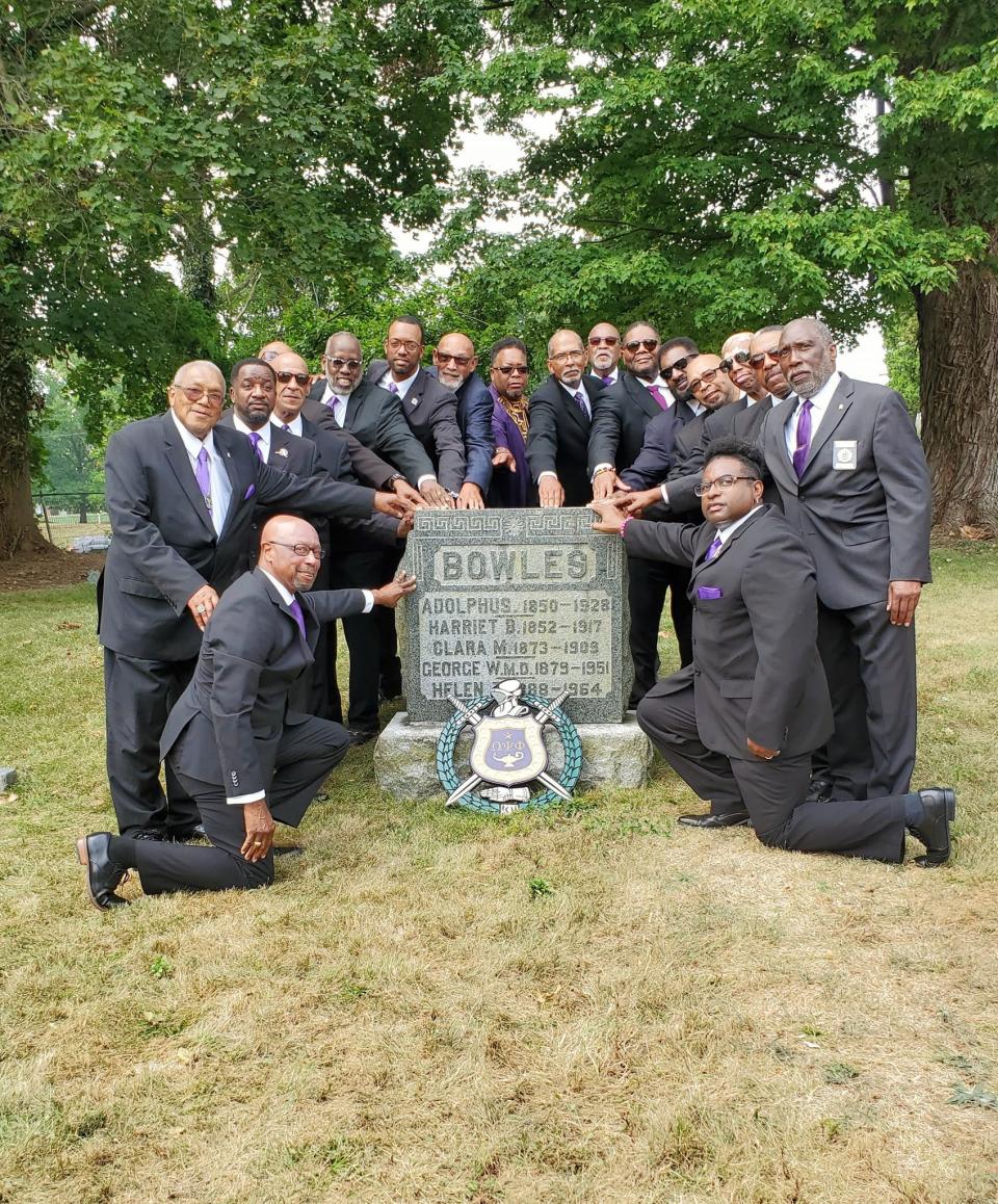 Members of the Omega Psi Phi Fraternity’s Kappa Omega Chapter gather as part of the chapter’s 100th anniversary observances. They are pictured around the grave site in North York’s Lebanon Cemetery of York physician Dr. George Bowles, a founding member of the chapter.