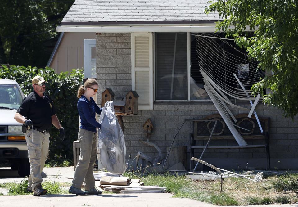 Law enforcement agents investigate at the home of Craig Deleeuw Robertson, who was shot and killed by FBI agents in Provo on Wednesday, Aug. 9, 2023. Robertson posted threatening comments about President Joe Biden hours before the president was scheduled to visit Utah. | Laura Seitz, Deseret News