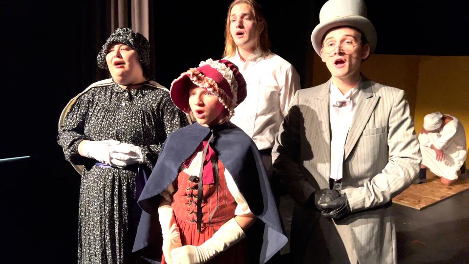 Katelyn Holstand, Hope Ronyak, Steven Fyten and Brennan Norwood serve as carolers in the Better Times Theatre Company’s rendition of “A Christmas Carol.”