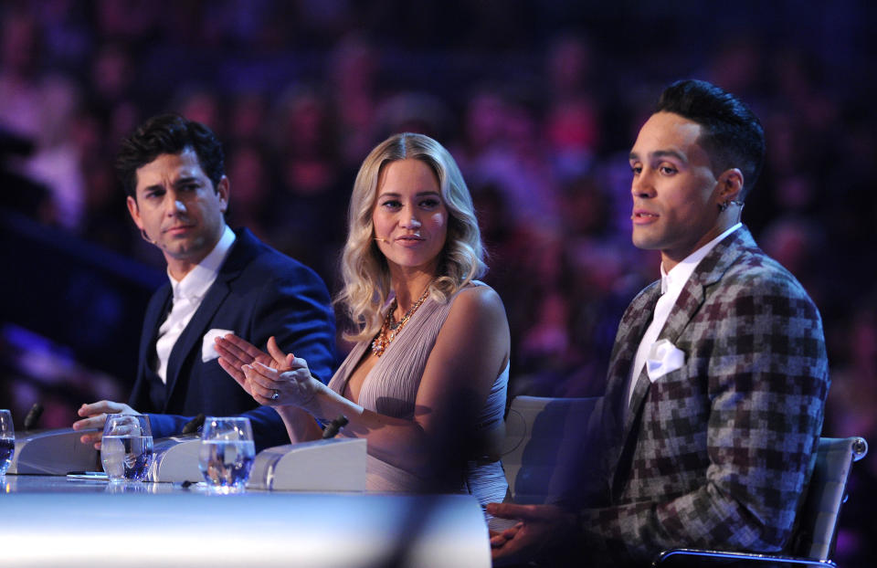 LONDON, ENGLAND - AUGUST 25:  Adam Garcia, Kimberley Wyatt and Ashley Banjo judge the first live show of 2014's "Got To Dance" at Earls Court on August 25, 2014 in London, England.  (Photo by Stuart C. Wilson/Getty Images)