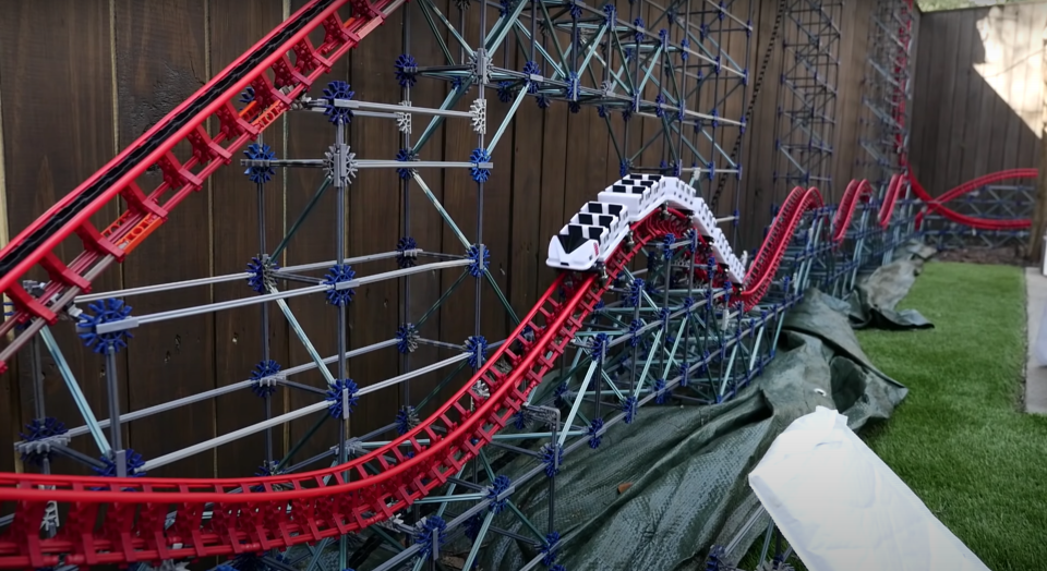 Model maker, CoasterWriter, has built a ten-foot-tall backyard-sized K'nex roller coaster, and the mini ride is endless fun to watch.