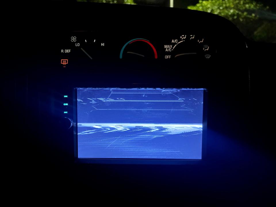 a fuzzy blue back up camera in a van