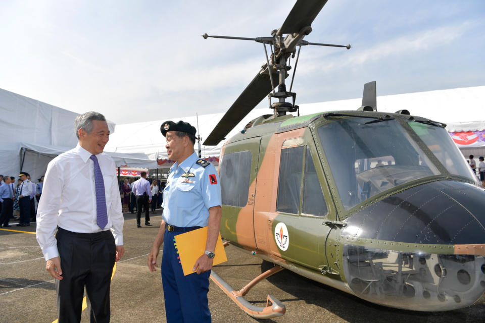 <p>PM Lee speaking with RSAF pioneer, Lieutenant-Colonel (RET) Leo Tin Boon at Tengah Air Base on Saturday (1 September). (PHOTO: Mindef) </p>