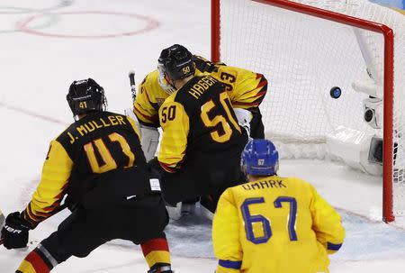Ice Hockey - Pyeongchang 2018 Winter Olympics - Men's Quarterfinal Match - Sweden v Germany - Kwandong Hockey Centre, Gangneung, South Korea - February 21, 2018 - Anton Lander of Sweden (not pictured) scores their first goal. REUTERS/Kim Kyung-Hoon