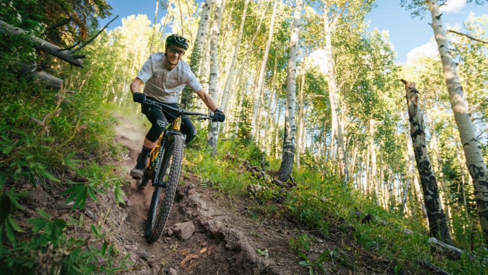 Revel Rascal V2 being ridden down a dust trail