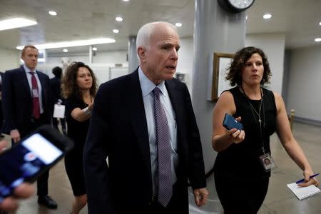 Sen. John McCain (R-AZ) speaks with reporters about the Senate health care bill on Capitol Hill in Washington, U.S., July 12, 2017. REUTERS/Aaron P. Bernstein