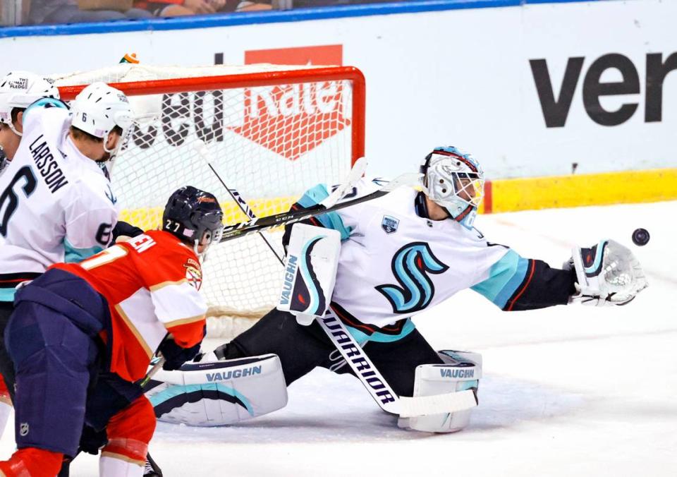 Seattle Kraken goaltender Chris Driedger (60) stop a shot against the Florida Panthers during the first period of an NHL game at the FLA Live Arena on Saturday, November 27, 2021 in Sunrise, Fl.