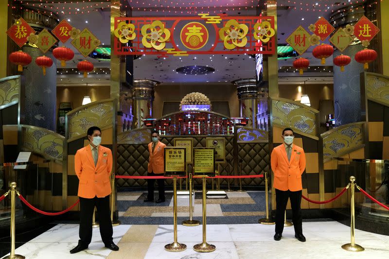 Security guards stand outside the closed Grand Lisboa casino, following the coronavirus outbreak in Macau