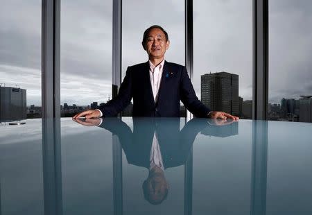 Japan's Chief Cabinet Secretary Yoshihide Suga poses for a photograph during a Thomson Reuters Newsmaker event in Tokyo, Japan August 30, 2016. REUTERS/Kim Kyung-Hoon