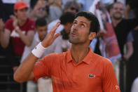 Serbia's Novak Djokovic celebrates after winning his final match against Greece's Stefanos Tsitsipas at the Italian Open tennis tournament, in Rome, Sunday, May 15, 2022. (AP Photo/Alessandra Tarantino)