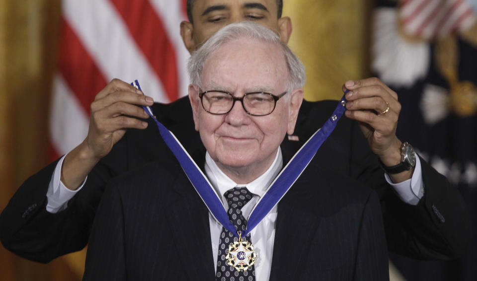 FILE - President Barack Obama awards the 2010 Medal of Freedom to Warren Buffett during a ceremony in the East Room of the White House in Washington, Feb. 15, 2011. Obama gave out more Presidential Medals of Freedom than any U.S. leader since its creation. (AP Photo/Charles Dharapak, File)