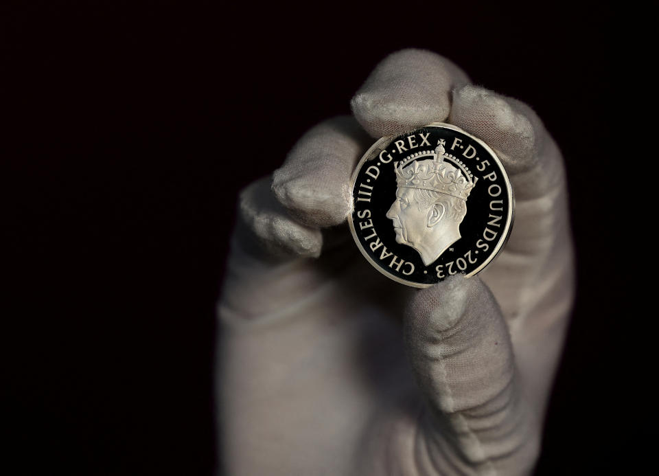 A commemorative five pound coin is unveiled by The Royal Mint to celebrate the upcoming coronation of King Charles III, in Llantrisant, Britain, April 12, 2023. REUTERS/Molly Darlington