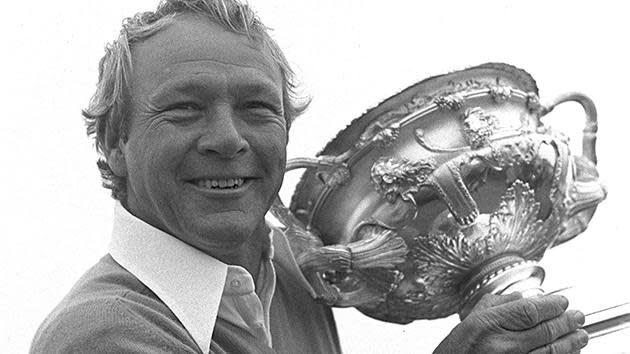 Palmer hoists the trophy after winning the 1975 PGA tournament at Penfold.