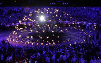 The Olympic cauldron is lit during the Opening Ceremony at the 2012 Summer Olympics, Saturday, July 28, 2012, in London. (AP Photo/Mark Baker)