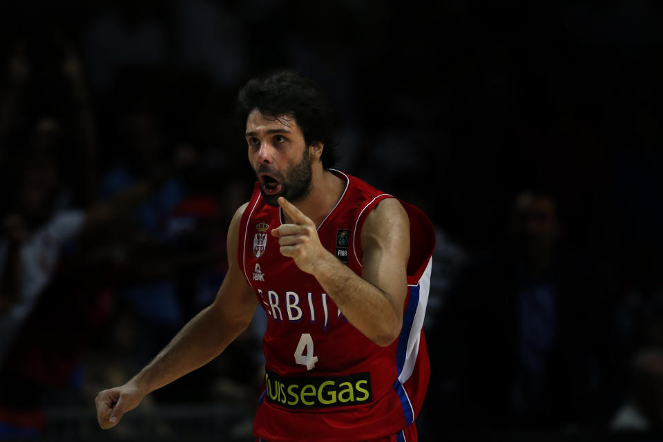 Serbia&#39;s Milos Teodosic celebrates at the end of the Basketball World Cup semifinal between Serbia and France in Madrid, Spain, Friday, Sept. 12, 2014. The 2014 Basketball World Cup competition will take place in various cities in Spain from Aug. 30 through to Sept. 14. Serbia won 90-85 and will play the U.S.A. in the final on Sunday. (AP Photo/Daniel Ochoa de Olza)