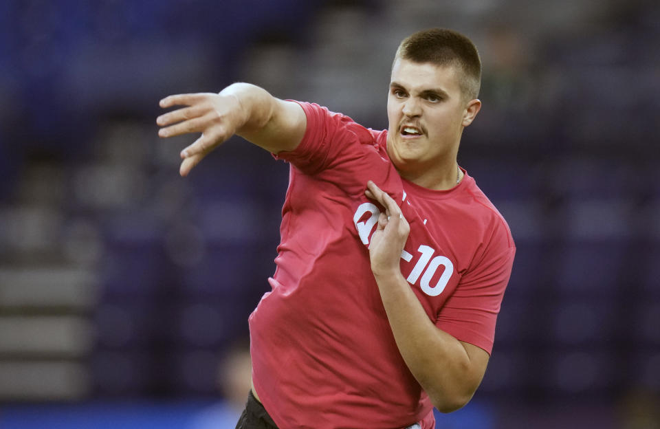 FILE - Purdue quarterback Aidan O'Connell runs a drill at the NFL football scouting combine in Indianapolis, Saturday, March 4, 2023. In the first nine drafts after former sixth-round pick Tom Brady won his first Super Bowl following the 2002 season, there were an average of seven QBs taken in the final three rounds of the draft. (AP Photo/Michael Conroy, File)